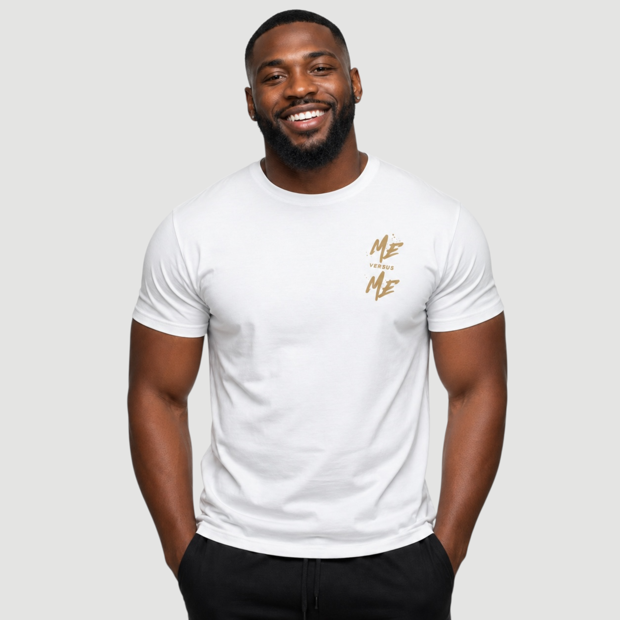 Man wearing a white t-shirt with 'Me Over Me' text on a plain background