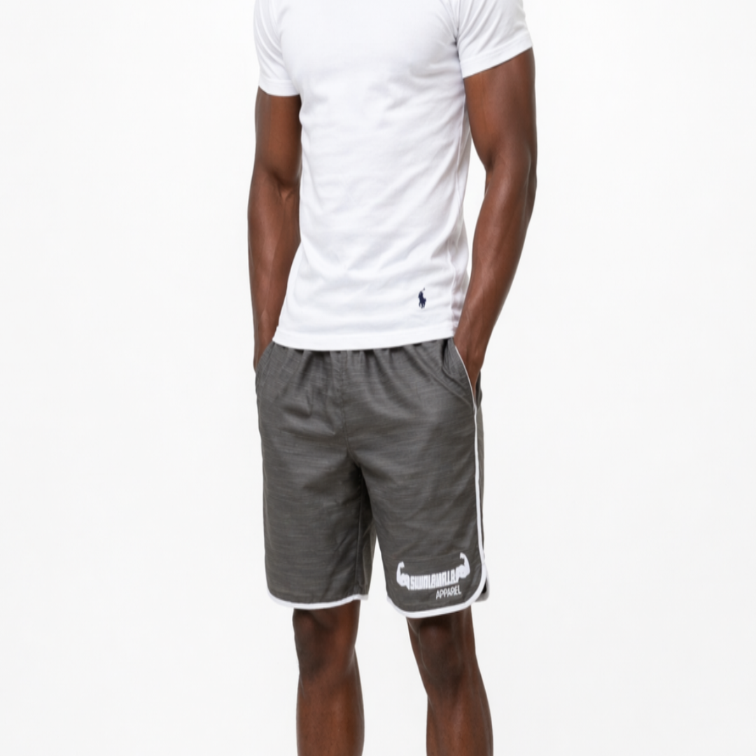 Man wearing a white t-shirt and gray shorts on a white background