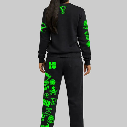 Black tracksuit with green patterns on a gray background